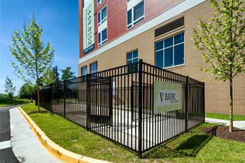 a wrought iron fence in front of a school